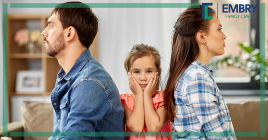 child in middle of parents