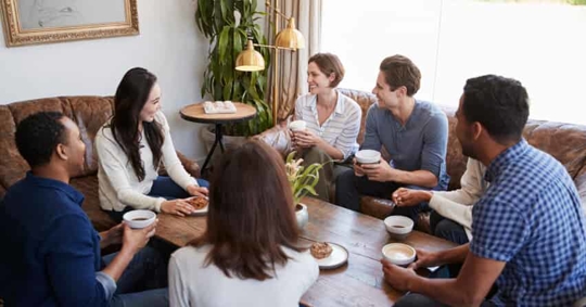 adults drinking coffee and talking