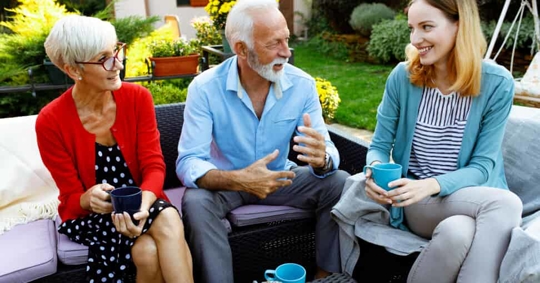 older couple talking to their daughter
