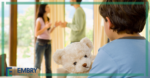 child in front of fighting parents